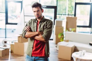 Storage units Manhattan - Man standing in front of moving boxes