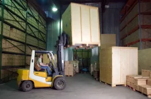 Business self storage solutions Boxie24 Storage - Forklift carrying a heavy crate.