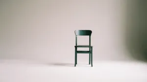 Declutter your life - one black chair in an empty room