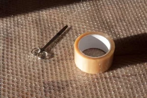 Air cushion, a scissor and wrapping tape