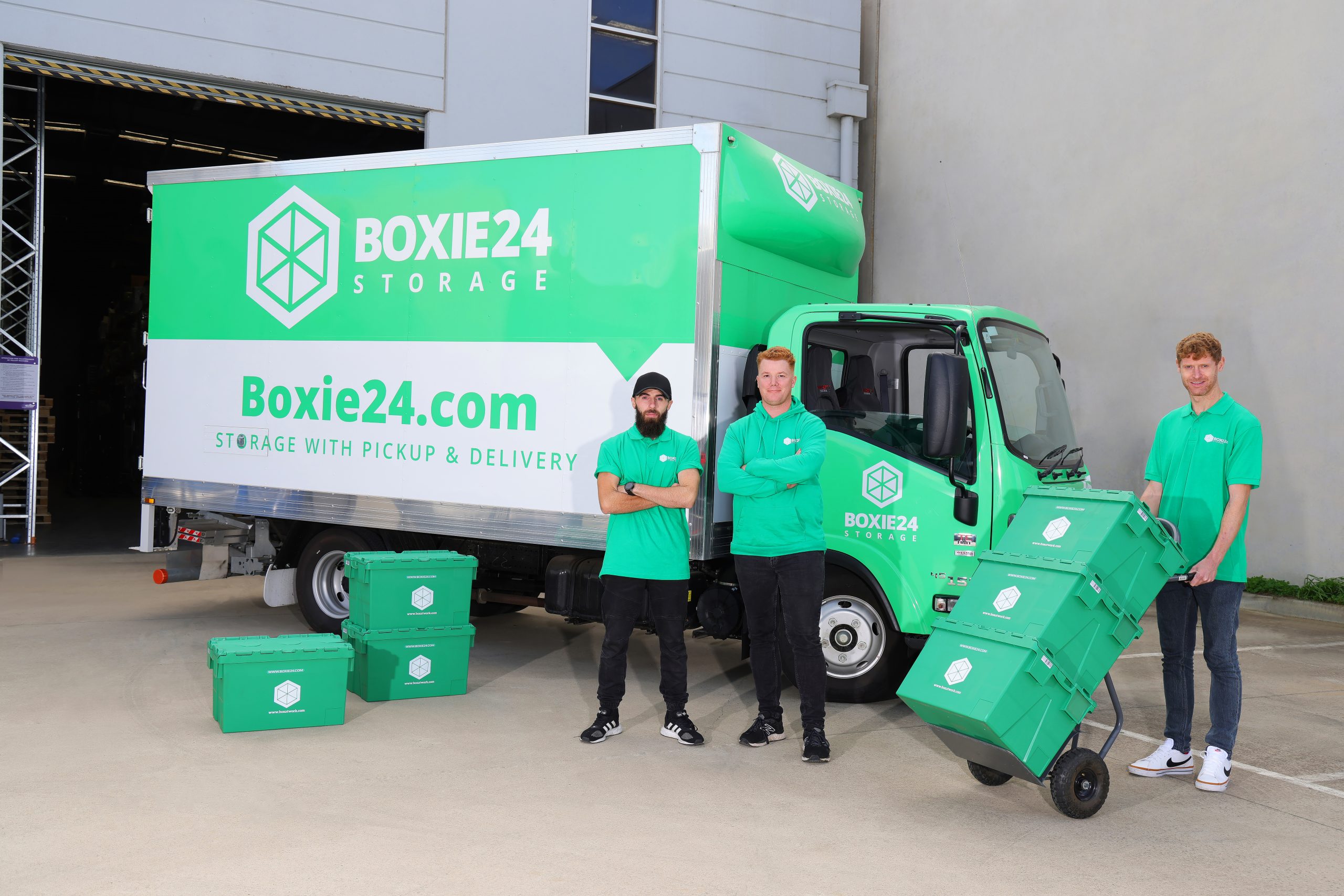 Boxie24 employee with a pallet truck and Boxie24 moving boxes