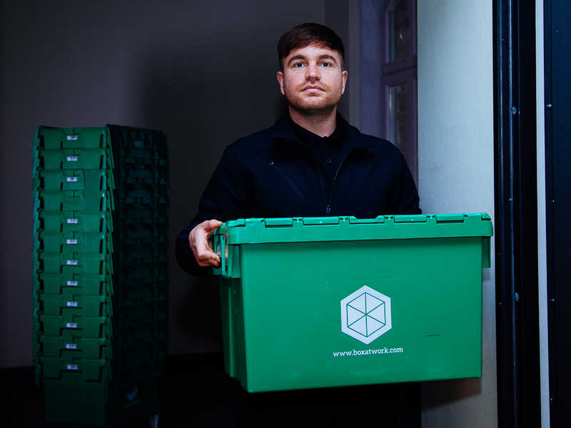 A worker with a BOXIE24 moving box