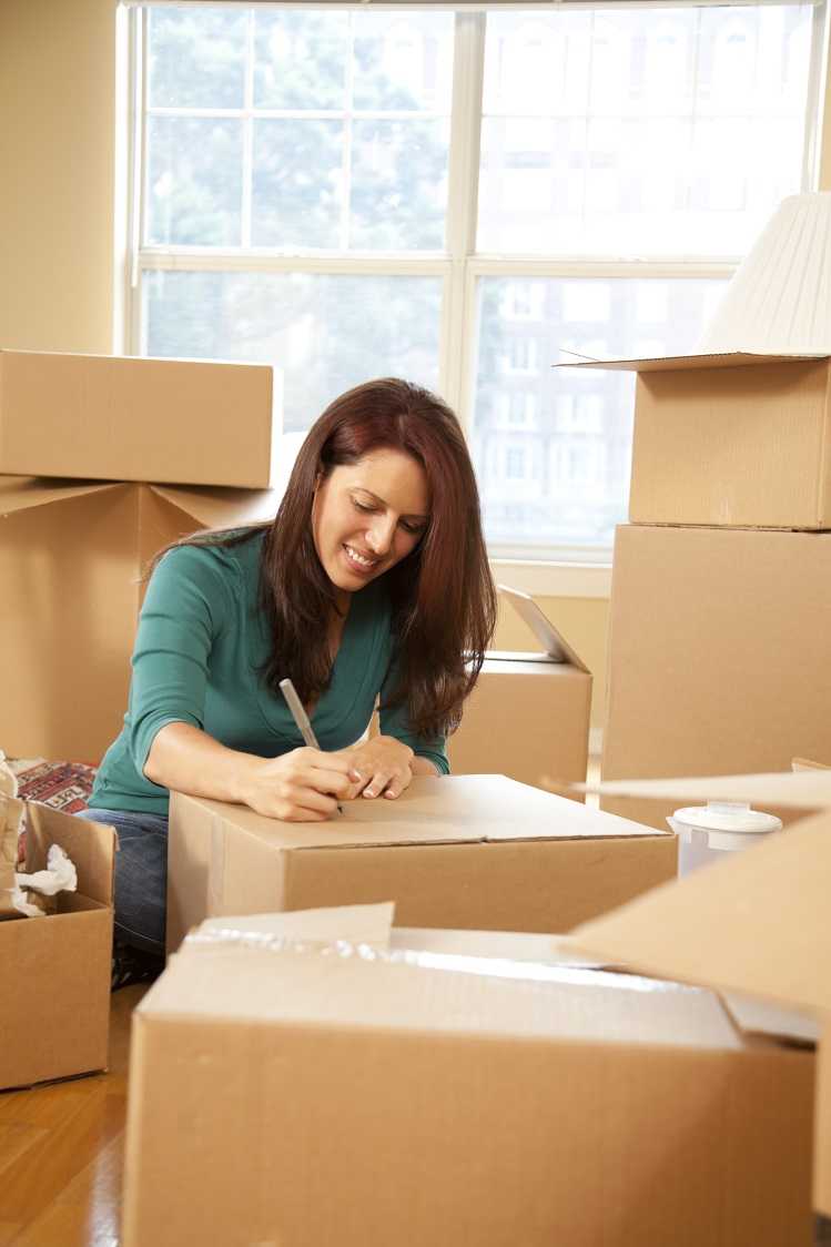 A woman packing up her belonings to split the house after a divorce