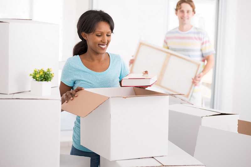 A woman and a man are packing up their stuff to split the house after a divorce