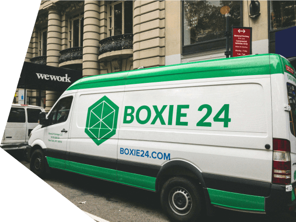 A van with the Boxie24 logo on it. 