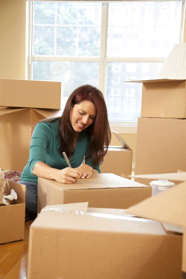 A woman packing up her belongings to split the house after a divorce